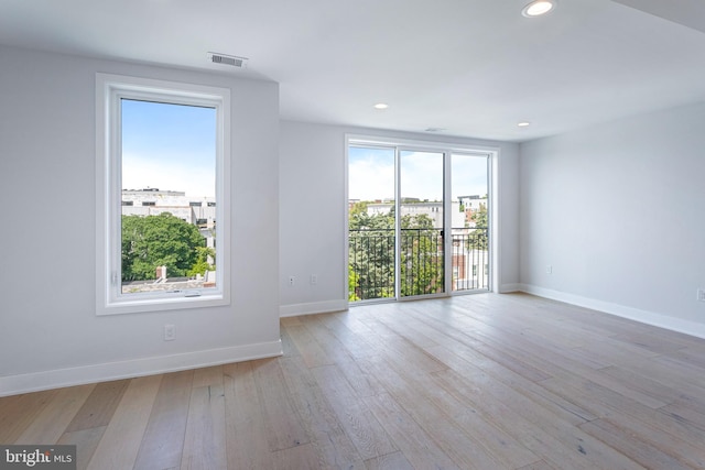 845 19th St NE Unit Ph-12, Washington, DC 20002 - empty room featuring healthy amount of natural light, baseboards, light wood-style flooring, and recessed lighting