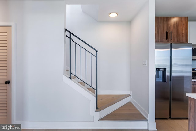 845 19th St NE Unit Ph-12, Washington, DC 20002 - stairway featuring wood finished floors and baseboards