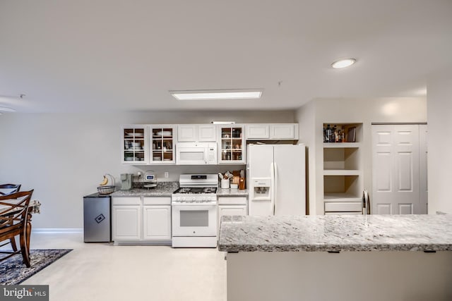 2212 Palustris Ln, Abingdon, MD 21009 - kitchen featuring white appliances, white cabinets, glass insert cabinets, and light stone countertops