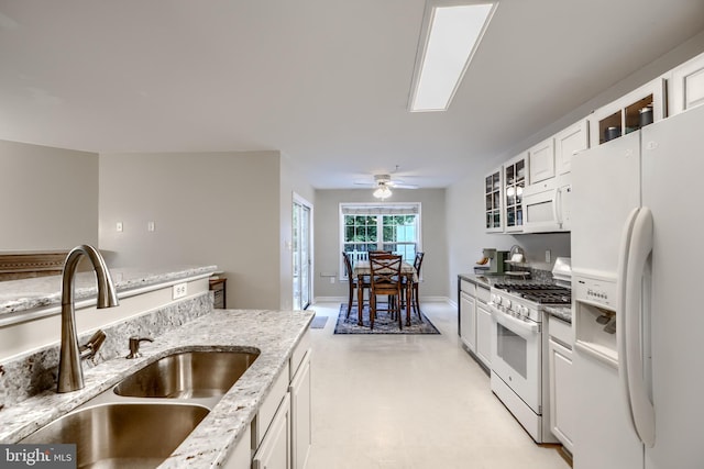 2212 Palustris Ln, Abingdon, MD 21009 - kitchen featuring white appliances, a sink, white cabinetry, light stone counters, and glass insert cabinets