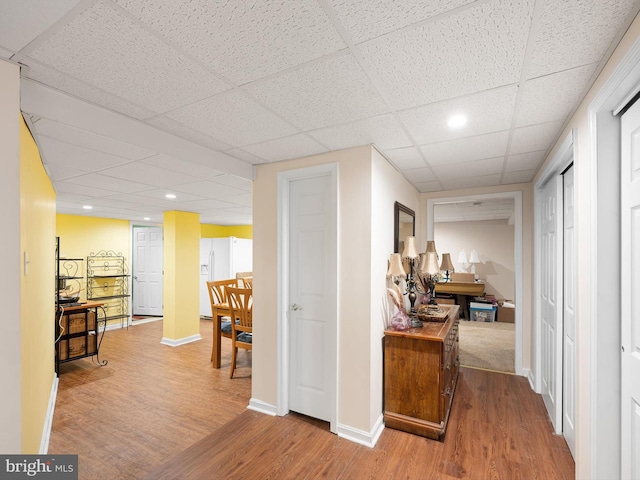 35553 Dry Brook Dr, Rehoboth Beach, DE 19971 - hall featuring wood finished floors, a paneled ceiling, baseboards, and recessed lighting
