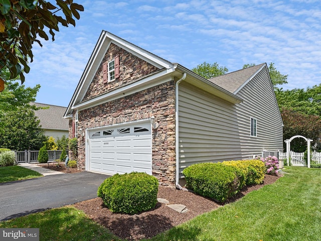 35553 Dry Brook Dr, Rehoboth Beach, DE 19971 - view of side of home featuring stone siding, asphalt driveway, and a shingled roof