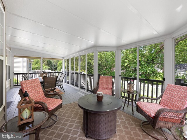 35553 Dry Brook Dr, Rehoboth Beach, DE 19971 - sunroom featuring outdoor dining space and vaulted ceiling