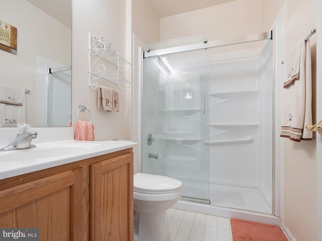 35553 Dry Brook Dr, Rehoboth Beach, DE 19971 - bathroom with a stall shower, tile patterned floors, vanity, and toilet
