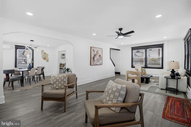 24 Cuthbert Rd, Cinnaminson, NJ 08077 - living room with a chandelier, healthy amount of natural light, arched walkways, and recessed lighting