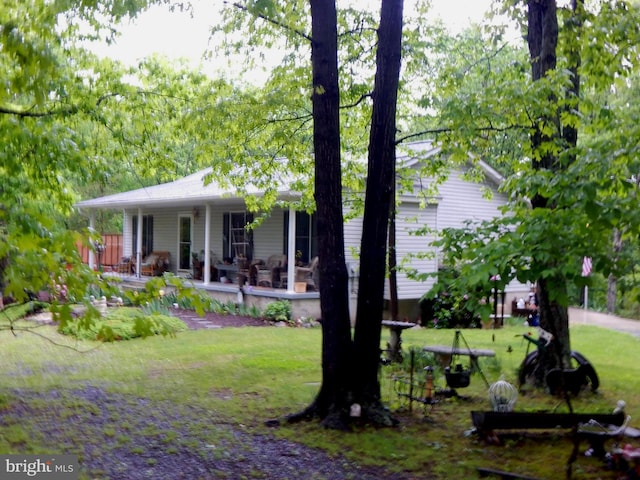 523 Zig Zag Ln, Inwood, WV 25428 - view of front of home with covered porch and a front lawn