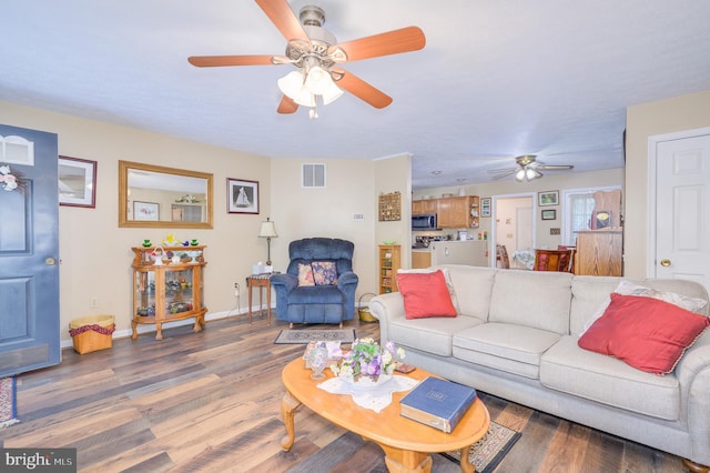 523 Zig Zag Ln, Inwood, WV 25428 - living area with a ceiling fan, wood finished floors, and baseboards