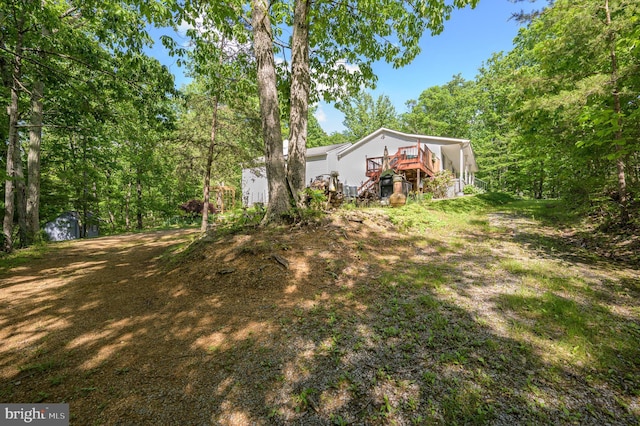 523 Zig Zag Ln, Inwood, WV 25428 - view of yard featuring a wooden deck and stairway