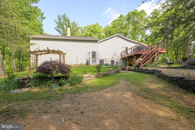 523 Zig Zag Ln, Inwood, WV 25428 - rear view of property with a deck, stairs, a pergola, and a chimney