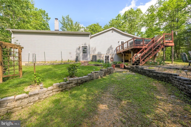 523 Zig Zag Ln, Inwood, WV 25428 - back of property with stairway, a deck, a yard, and a chimney