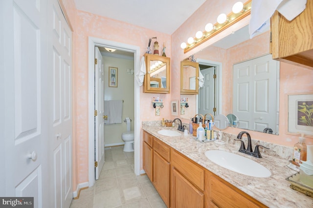 523 Zig Zag Ln, Inwood, WV 25428 - full bathroom with toilet, tile patterned floors, double vanity, and baseboards