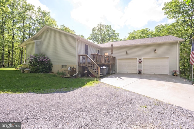 523 Zig Zag Ln, Inwood, WV 25428 - view of front of home featuring driveway, a garage, a front lawn, a deck, and stairway