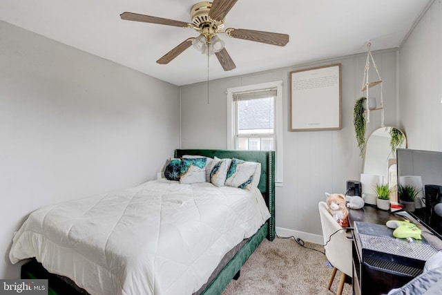 carpeted bedroom featuring ceiling fan and baseboards