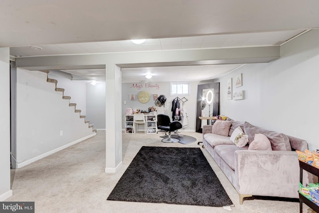living area featuring carpet flooring, stairway, and baseboards