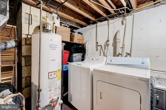 laundry room featuring gas water heater and washer and clothes dryer
