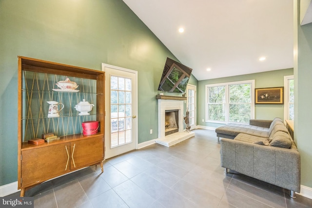 329 Dickinson Ave, Swarthmore, PA 19081 - living room featuring baseboards, a brick fireplace, tile patterned flooring, high vaulted ceiling, and recessed lighting