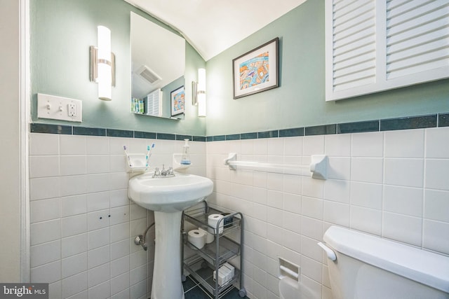 329 Dickinson Ave, Swarthmore, PA 19081 - bathroom with toilet and tile walls