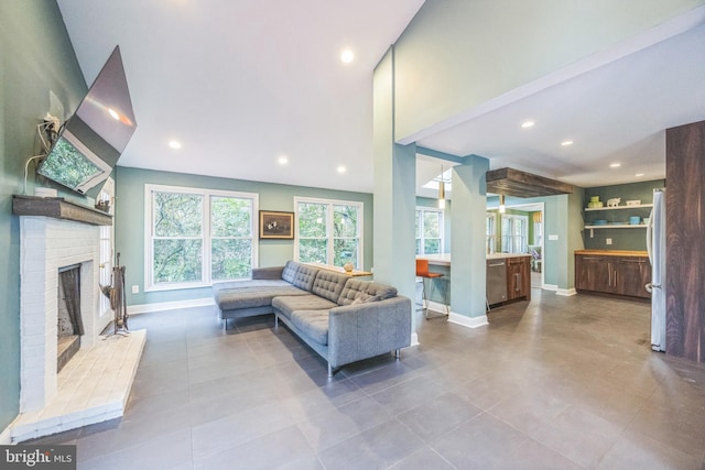 329 Dickinson Ave, Swarthmore, PA 19081 - tiled living room featuring baseboards, recessed lighting, and a fireplace