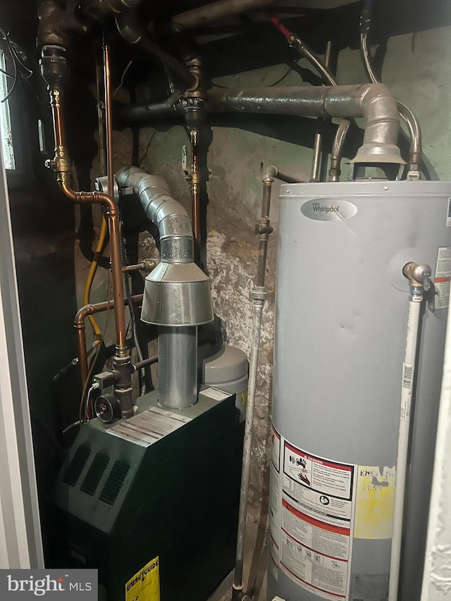 utility room featuring water heater