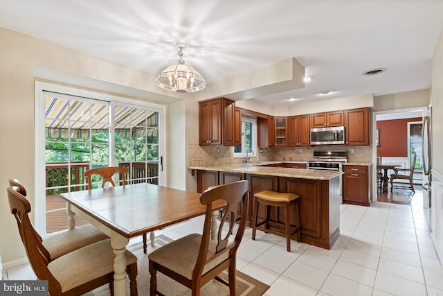 60 S Forge Manor Dr, Phoenixville, PA 19460 - dining area with a chandelier and light tile patterned floors
