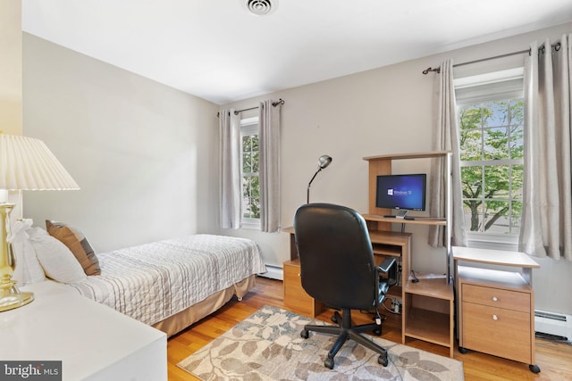 60 S Forge Manor Dr, Phoenixville, PA 19460 - bedroom featuring multiple windows, wood finished floors, baseboard heating, and an office area