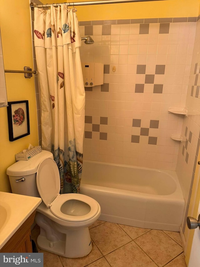 full bath with tile patterned floors, toilet, shower / bath combo with shower curtain, and vanity