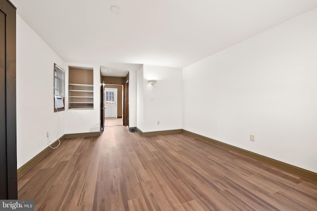 901 W Barre St, Baltimore, MD 21230 - spare room featuring wood finished floors and baseboards