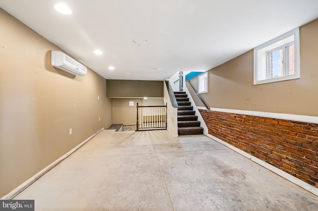 901 W Barre St, Baltimore, MD 21230 - basement featuring a wall mounted air conditioner, stairway, recessed lighting, and baseboards