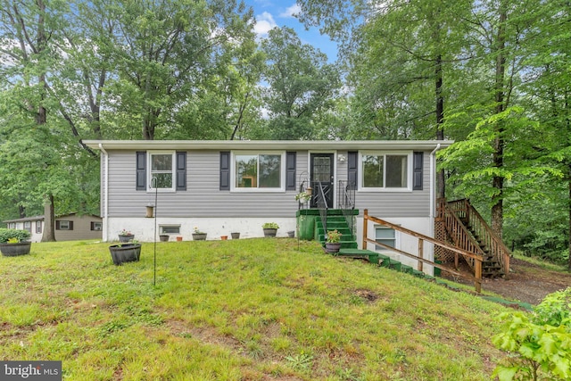 7570 Independence Cir, Charlotte Hall, MD 20622 - single story home with a front lawn, stairway, and view of scattered trees