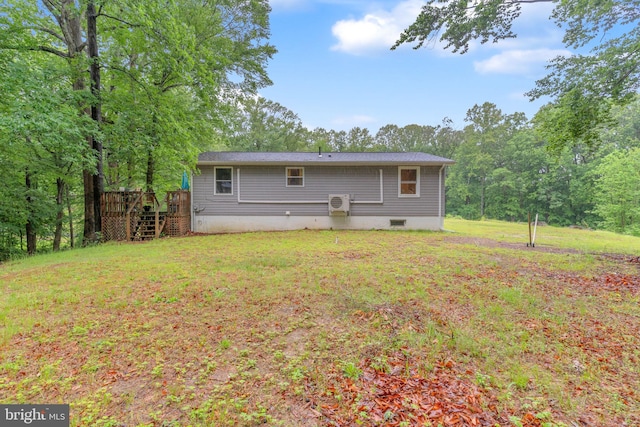 7570 Independence Cir, Charlotte Hall, MD 20622 - back of property featuring stairway, a wooden deck, and a lawn