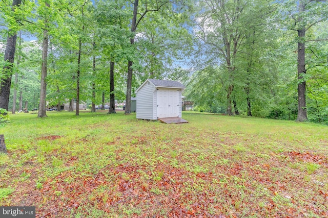 7570 Independence Cir, Charlotte Hall, MD 20622 - view of green lawn with a storage unit and an outbuilding