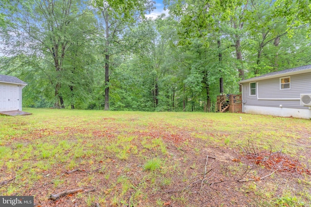 7570 Independence Cir, Charlotte Hall, MD 20622 - view of green lawn with stairway, a wooden deck, and an outdoor structure