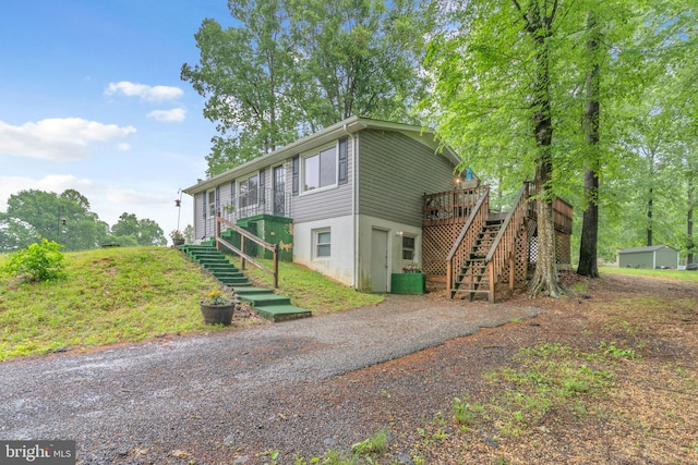 7570 Independence Cir, Charlotte Hall, MD 20622 - view of front of house featuring stairway, a deck, and driveway