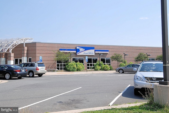 view of commercial location with uncovered parking