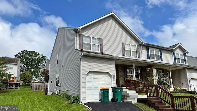 260 Shirley Ln, Pennsburg, PA 18073 - view of front facade with an attached garage, covered porch, and asphalt driveway