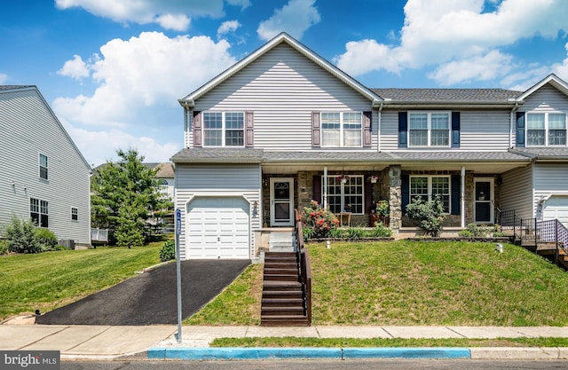 260 Shirley Ln, Pennsburg, PA 18073 - view of front facade featuring an attached garage, stairway, asphalt driveway, and a front yard