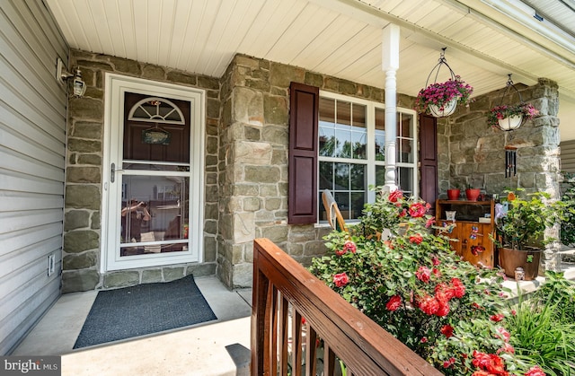 260 Shirley Ln, Pennsburg, PA 18073 - view of exterior entry featuring stone siding and covered porch