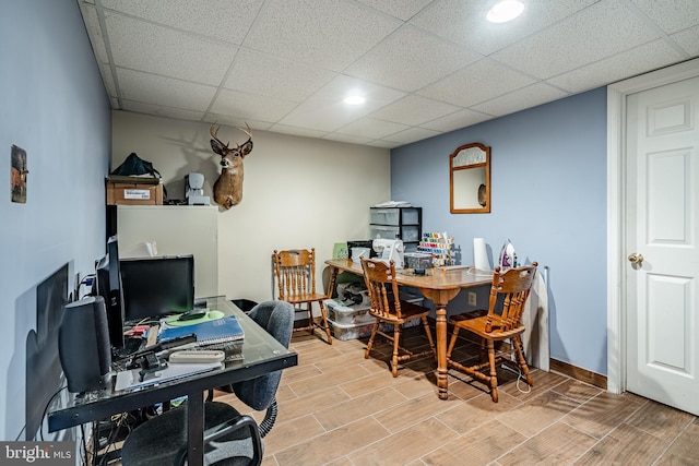260 Shirley Ln, Pennsburg, PA 18073 - home office with wood tiled floors, a paneled ceiling, and baseboards
