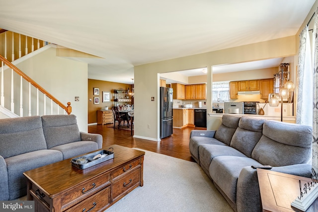 260 Shirley Ln, Pennsburg, PA 18073 - living area with stairs, dark wood-style floors, baseboards, and dark carpet