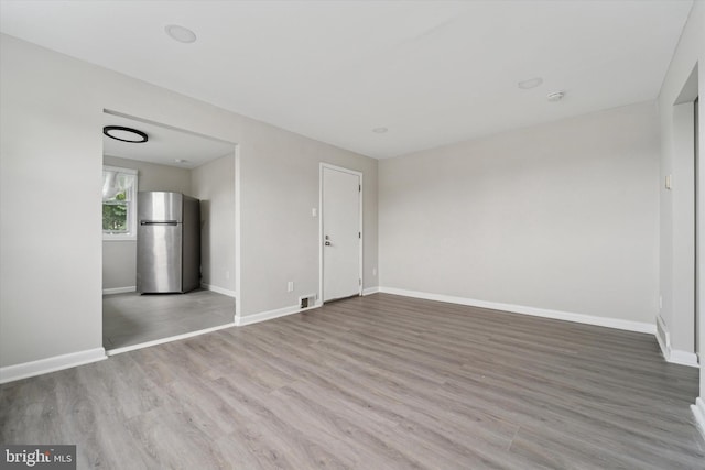 3819-3821 Garrett Rd, Drexel Hill, PA 19026 - unfurnished living room with baseboards and wood finished floors