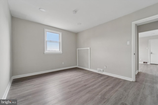 3819-3821 Garrett Rd, Drexel Hill, PA 19026 - spare room featuring wood finished floors, baseboards, and a smoke detector