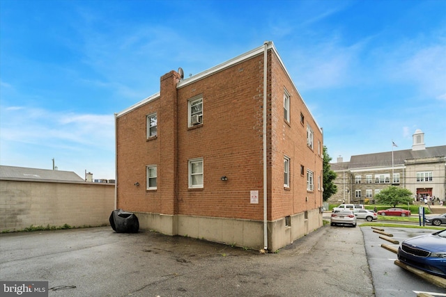 3819-3821 Garrett Rd, Drexel Hill, PA 19026 - view of side of home featuring brick siding and uncovered parking