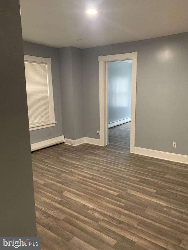 314 W State St, Trenton, NJ 08618 - unfurnished room featuring baseboard heating, baseboards, dark wood-style floors, and recessed lighting