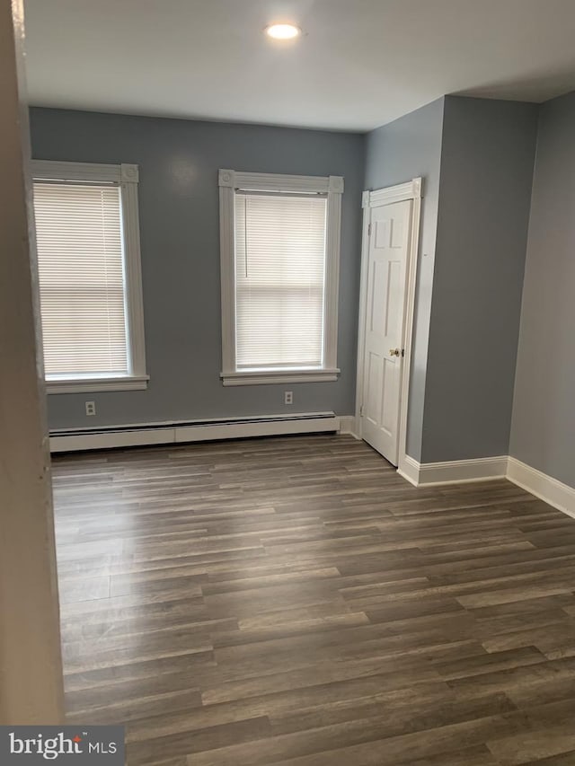 314 W State St, Trenton, NJ 08618 - empty room featuring a baseboard radiator, baseboards, recessed lighting, and wood finished floors