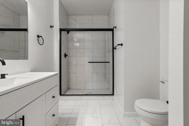 full bath featuring marble look tiles, a stall shower, toilet, vanity, and baseboards