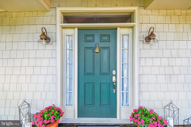view of exterior entry featuring a porch