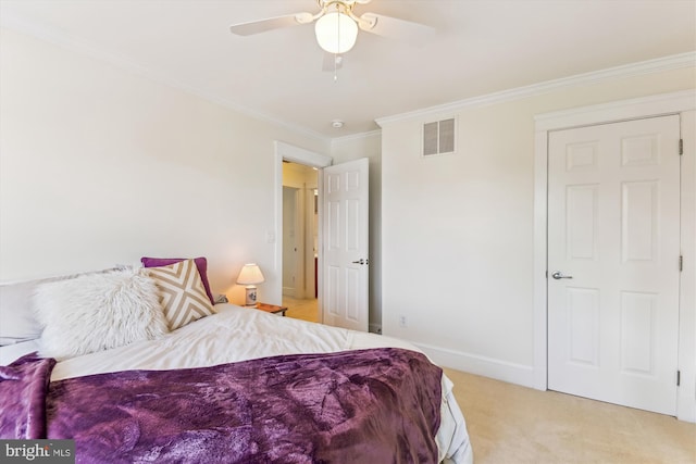 bedroom with crown molding, light colored carpet, ceiling fan, and baseboards