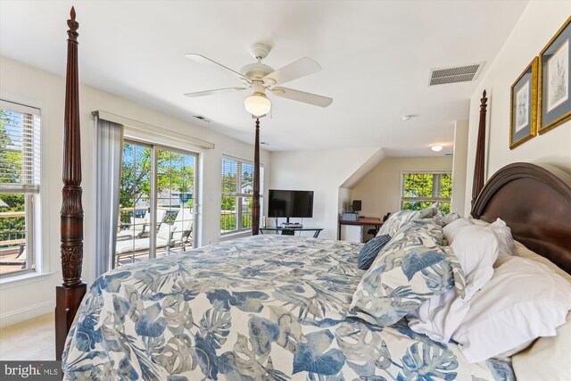 bedroom with access to outside, a ceiling fan, and carpet