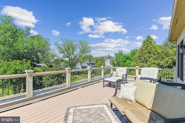wooden deck featuring outdoor lounge area