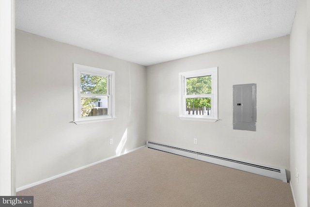 455 Commodore Dr, Forked River, NJ 08731 - empty room featuring baseboard heating, electric panel, healthy amount of natural light, carpet, and a textured ceiling